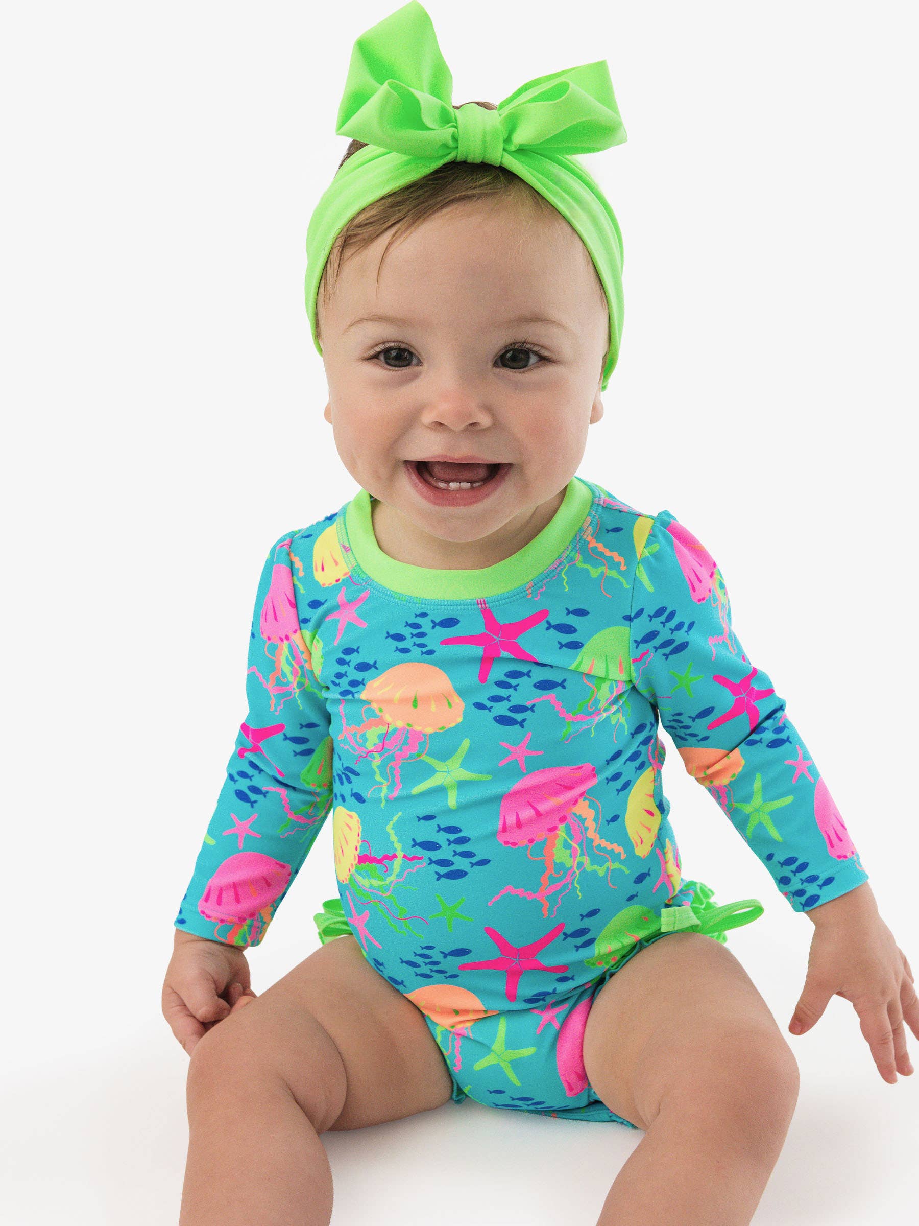 RuffleButts + RuggedButtsLong Sleeve One Piece Rash Guard Swimsuit - Neon Jelly Time - Image 2