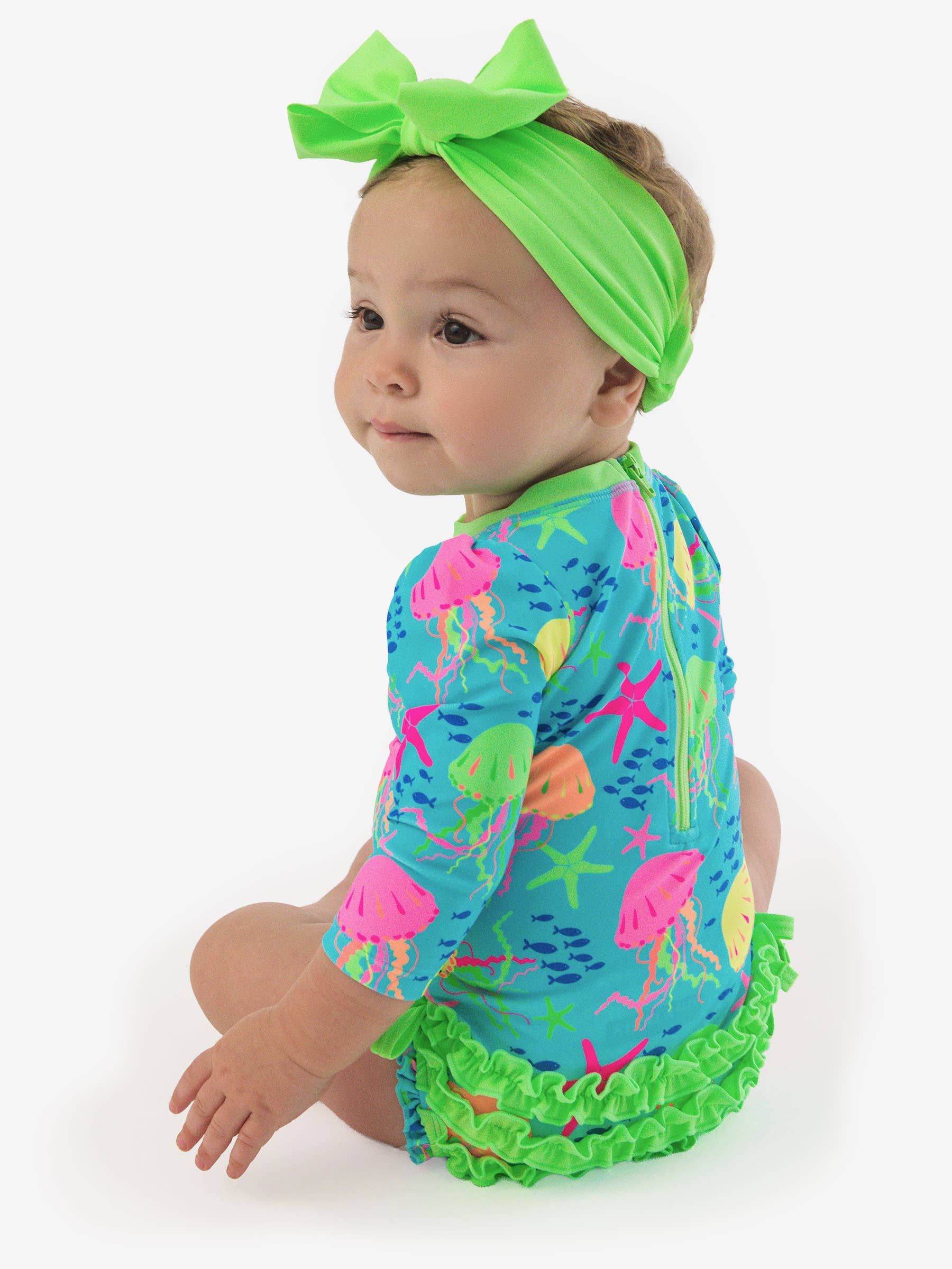 RuffleButts + RuggedButtsLong Sleeve One Piece Rash Guard Swimsuit - Neon Jelly Time - Image 4