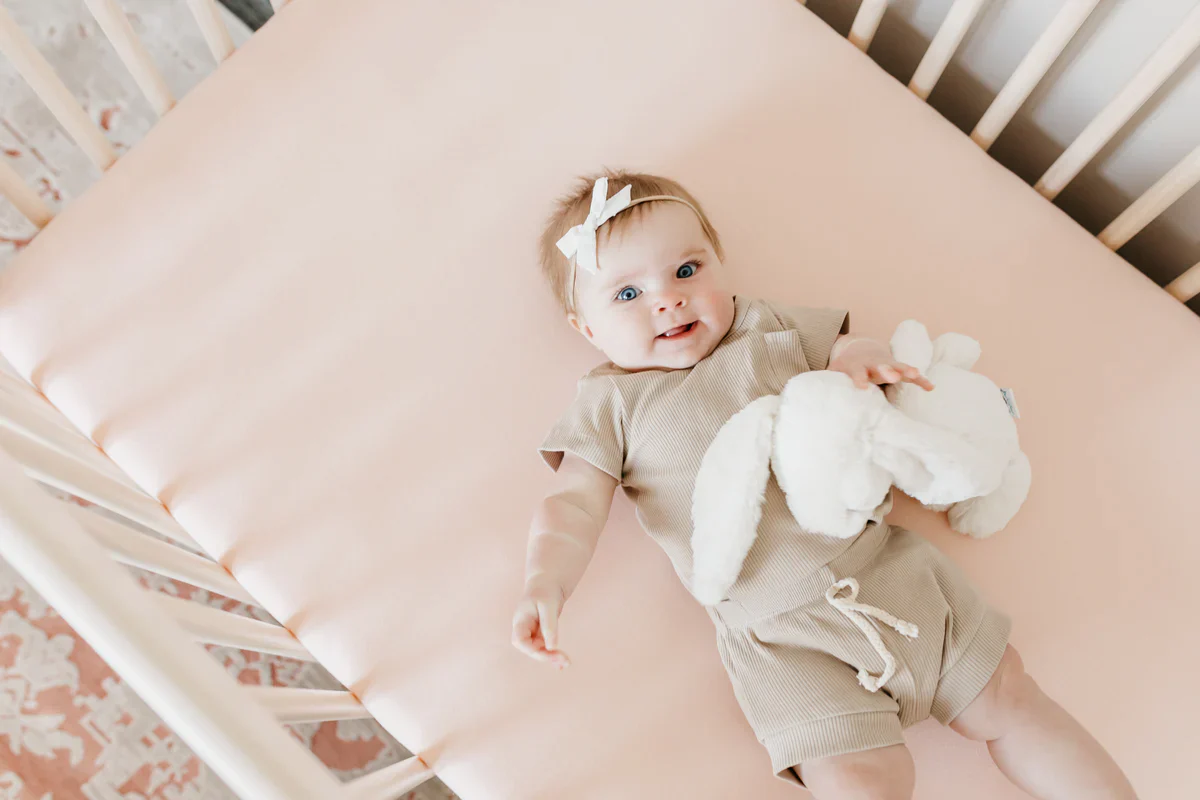 Copper Pearl Premium Knit Fitted Crib Sheet in Blush - Image 2